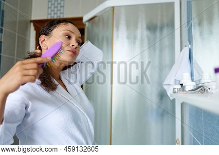 Pretty Woman In White Bathrobe, Combing Hair, Caring For Curly Chevelure, During Morning Routines, I