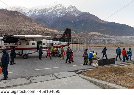 Jomsom, Nepal - November 24, 2016: Passenger Plane At Jomsom Airport. Simrik Airlines. People Get Of