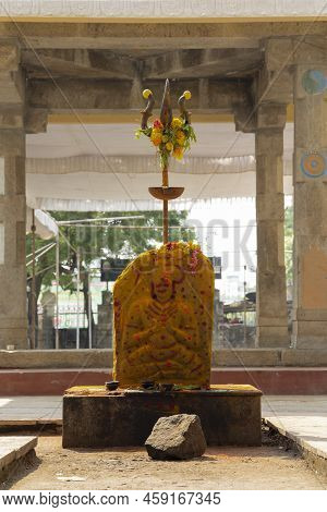 Trishool With Lemons And Flowers At The Opening Gate In A Hindu Goddess Temple
