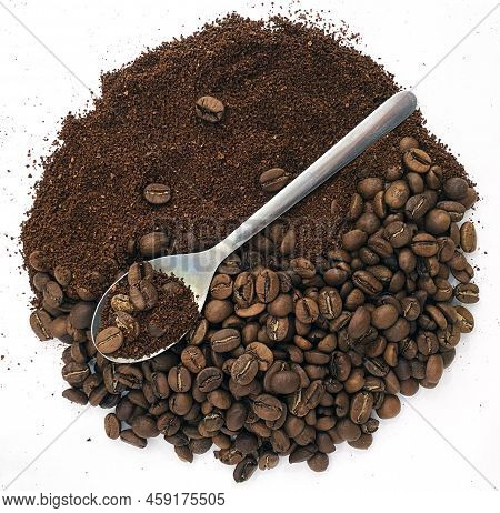 The Photo Shows Coffee Beans, Ground Coffee In The Shape Of A Circle On A White Background And A Spo