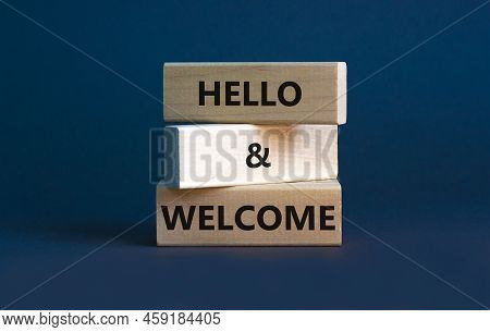 Hello And Welcome Symbol. Concept Words Hello And Welcome On Wooden Blocks. Beautiful Grey Backgroun