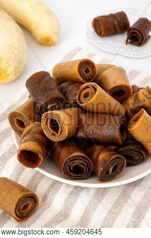 Pile Of Banana Pastila (fruit Leather) On Plate. Dehydrated Sweet Mashed Fruit Rolls. Natural Handma