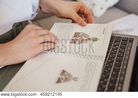 Tver, Russia-august 7, 2022. A Woman With A Laptop Is Studying Human Design. The Concept Of Studying