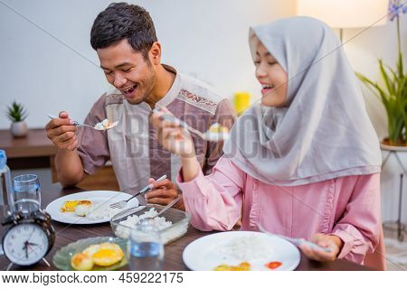 Muslim Couple Having Breakfast Or Sahur Early Morning
