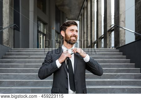 Happy Fired Office Worker, Rejoices And Laughs. Satisfied The Employee Throws Out A Tie. Portrait Of