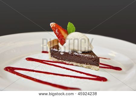 Closeup Of Dark Chocolate Tart On A Plate