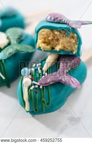Sliced Cakesicles With A Chocolate Mermaid Tail.