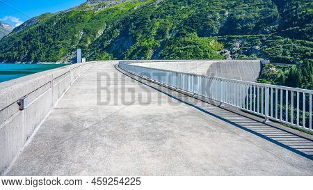 Huge Concrete Apline Dam On Sunny Summer Day. Zillergrundl Speicher, Zillertal Alps, Austria