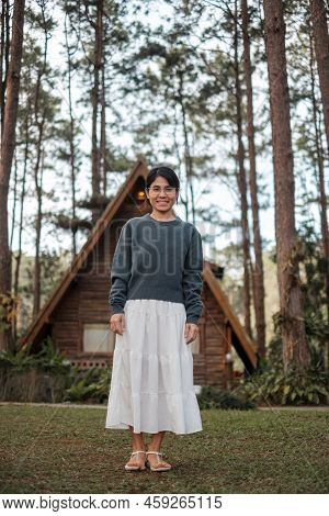 Happy Woman In Sweater Traveling In Pine Tree Forest, Tourist Visit At Doi Bo Luang, Chiang Mai, Tha