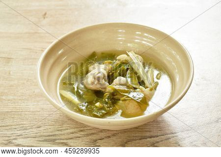 Boiled Chicken And Bone With Cowa Leaf Tom Yum Soup On Bowl