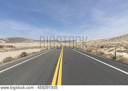 Road In The Middle Of Nowhere Passing The Desert In The Usa