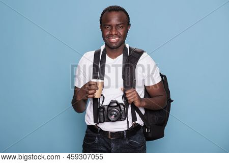 Tourist With Professional Camera And Travel Backpack Ready For Holiday Journey On Citybreak. African