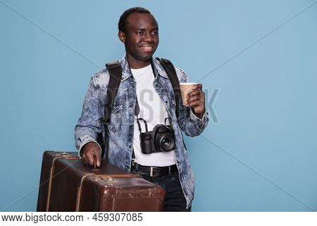 Professional Photographer With Camera And Luggage Ready For Holiday Urban Citybreak. Happy Young Pho