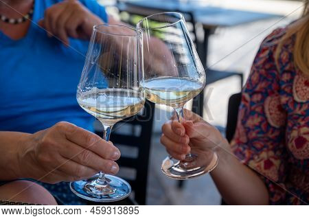 Drinking Of Txakoli Or Chacolí Slightly Sparkling Very Dry White Wine Produced In Spanish Basque Cou