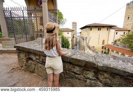 Tourism In Tuscany. Young Woman Tourist Enjoying From Viewpoint Of The Historic Medieval Town Of Are