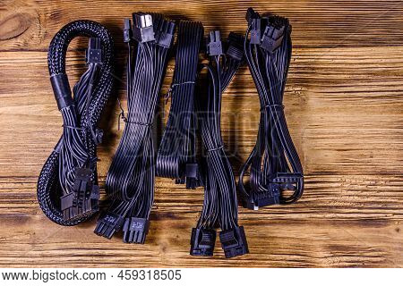 Set Of Computer Psu Cables On Wooden Background