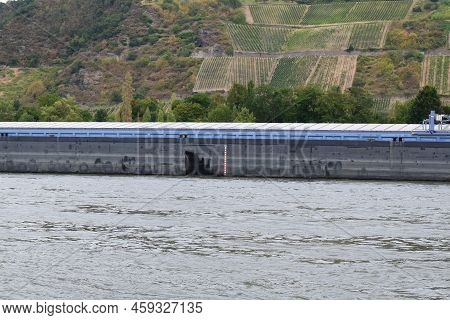 Middle Part Of A Cargo Ship With A Little Load During Low Water Level Time