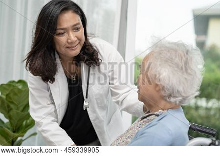 Help And Care Asian Senior Or Elderly Old Lady Woman Patient Sitting On Wheelchair At Nursing Hospit
