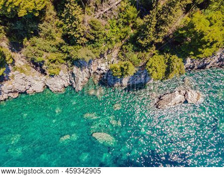 Picturesque Sea Adriatic Coast Of Montenegro. Turquoise Mediteran Sea And Rocky Shore With Evergreen
