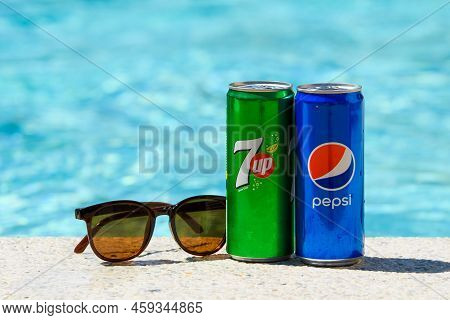 Novorossiysk - Russia, July 2022: Cans Of Pepsi Cola And 7up And Sunglasses By The Pool On A Summer 