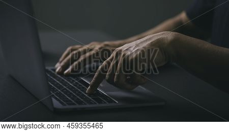 Young Businessman Sitting At Work With His Laptop On A Wooden Table,virtual Training Used In Online 