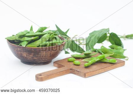 Raw Green Edamame Soybeans. Edamame, Fresh Green Soybeans In Pod. Healthy Vegan Food.
