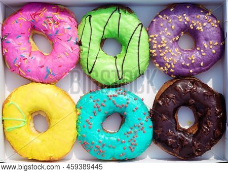 Donuts In Cardboard Packaging. Doughnuts Set With Sprinkles In Paper Box. Sweet Snack, Dessert, Frie