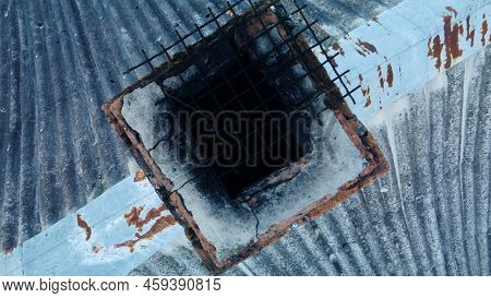 Furnace Chimney With Traces Of Soot. Chimney On The Roof, Covered With Old Slate. Aerial Photography