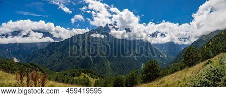 Panorama Of Mountains With Beautiful Clouds And Waterfalls In North Ossetia.
