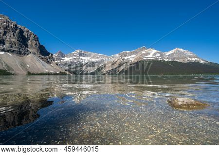 Calm Water Of Bow Lake In Banff National Park, Along The Icefields Parkway