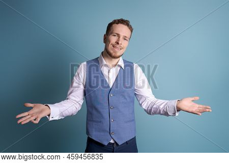 Portrait Handsome Business Man With Charming Smile, Gesturing With His Hands While Standing At Casua