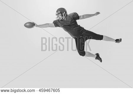 Dynamic Portrait Of American Football Player In Action And Motion Isolated On White Background. Conc