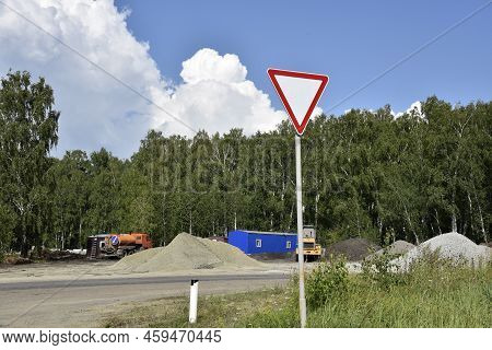 Stormy Landscape And Road Construction. Give Way Sign. Green Transportation.