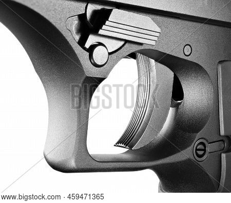 Semi-auto Handgun Trigger With Texturing For A Positive Grip That Is Isolated On White.