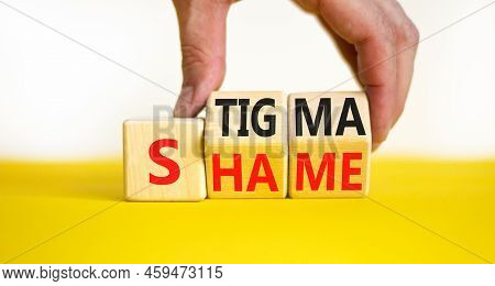 Stigma Or Shame Symbol. Concept Words Stigma Or Shame On Wooden Cubes. Businessman Hand. Beautiful Y