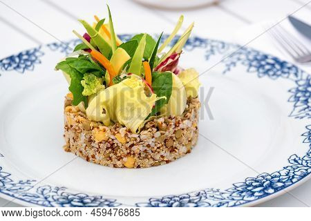 Quinoa Salad With Avocado, Carrot, Chickpeas And Fresh Greens