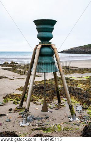 The Tide Bell At  Low Tide On The Beach At Cemaes On The Island Of Anglesey In North Wales
