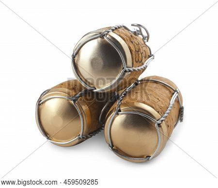 Corks Of Sparkling Wine And Muselet Caps On White Background
