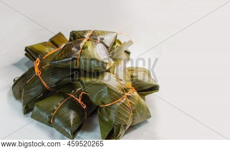 Traditional Nacatamales In Banana Leaves Isolated, View Of Homemade Nacatamales With Banana Leaf On
