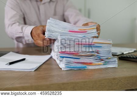 Business Documents Concept  Document Achieves On Folders Papers At Busy Work Desk Office