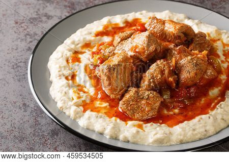 Turkish Hunkar Begendi Meat On A Bed Of Baked Eggplant With Bechamel Closeup In The Plate On The Tab