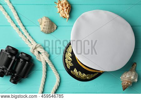 Peaked Cap, Rope, Shells And Binoculars On Turquoise Wooden Background, Flat Lay