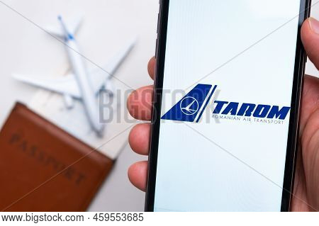 Tarom Romanian Air Transport Airlines Company App Or Logo Displayed On A Mobile Phone With Passport,