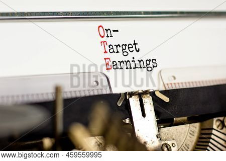 Ote On-target Earnings Symbol. Concept Words Ote On-target Earnings Typed On Old Retro Typewriter On