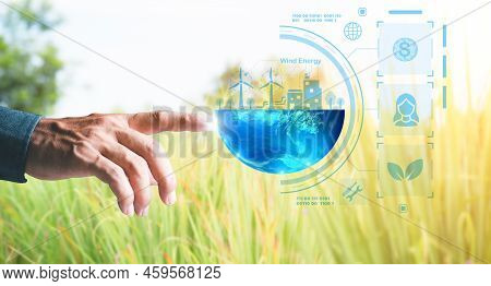 Young Businessman Pointing To An Icon , Alternative Energy Concepts To Conserve Resources That Uses 