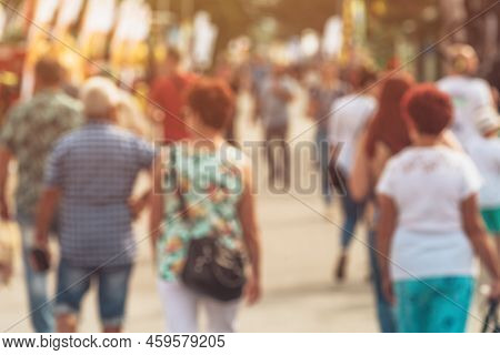 Blurred Pedestrian Walking Down The City Street, Unrecognizable Crowd Of People In Bokeh For Census 