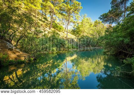 Lake In The Seven Springs Waterfall Forest Area In The Island Of Rhodes, Greece, Europe.