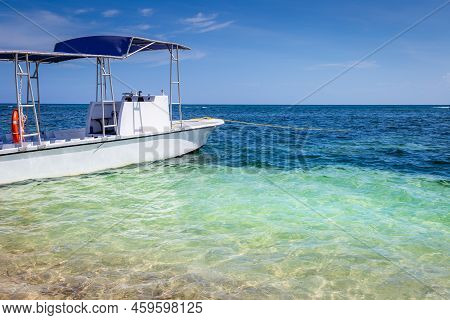 Translucent Caribbean Beach With Motorboat, Negril Seven Mile Beach, Jamaica