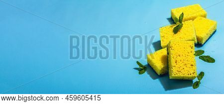 Bright Yellow Sponges For Washing Dishes. Organic Cleaning Concept, Minty Freshness