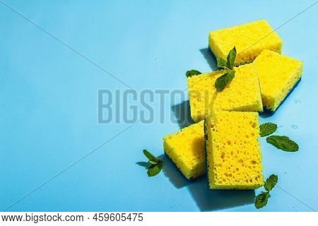 Bright Yellow Sponges For Washing Dishes. Organic Cleaning Concept, Minty Freshness